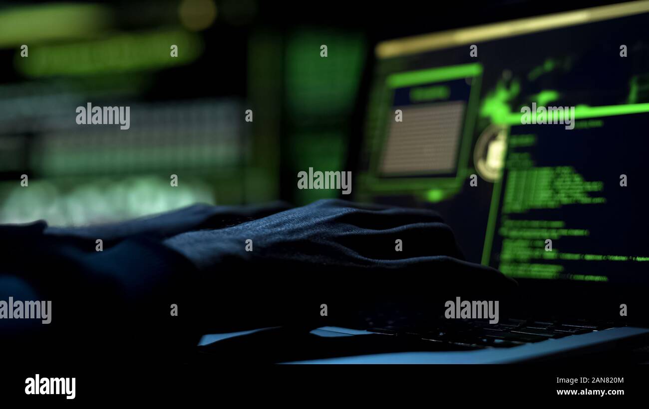 Male hands typing computer code, security program for database or servers Stock Photo