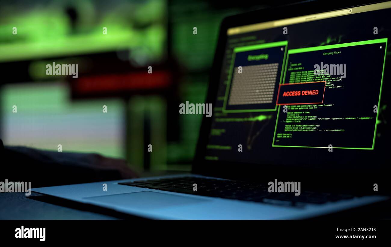 Message Access denied written on laptop screen, server blocking hacking attempt Stock Photo