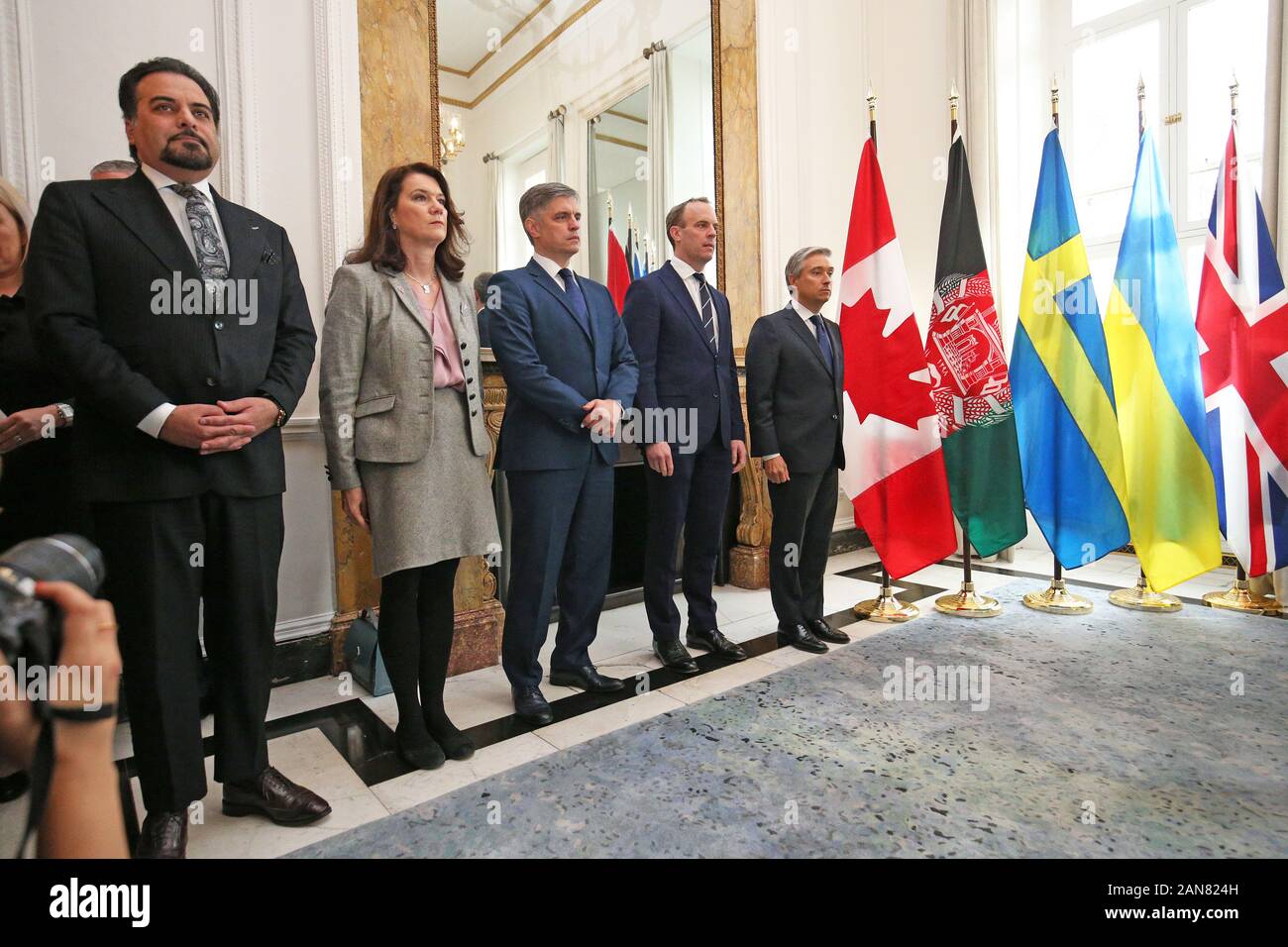 (left to right) Idrees Zaman, Acting Foreign Minister for Afghanistan, Ann Linde, Swedish Minister of Foreign Affairs, Vadym Prystaiko, Ukrainian Minister of Foreign Affairs, Foreign Secretary Dominic Raab and Francois-Philippe Champagne, Canadian Minister of Foreign Affairs, during a moment of reflection at Canada House, central London for the passengers of the Ukrainian International Airlines flight that crashed just minutes after taking off from Imam Khomeini International Airport in Tehran, killing 176 people. Stock Photo
