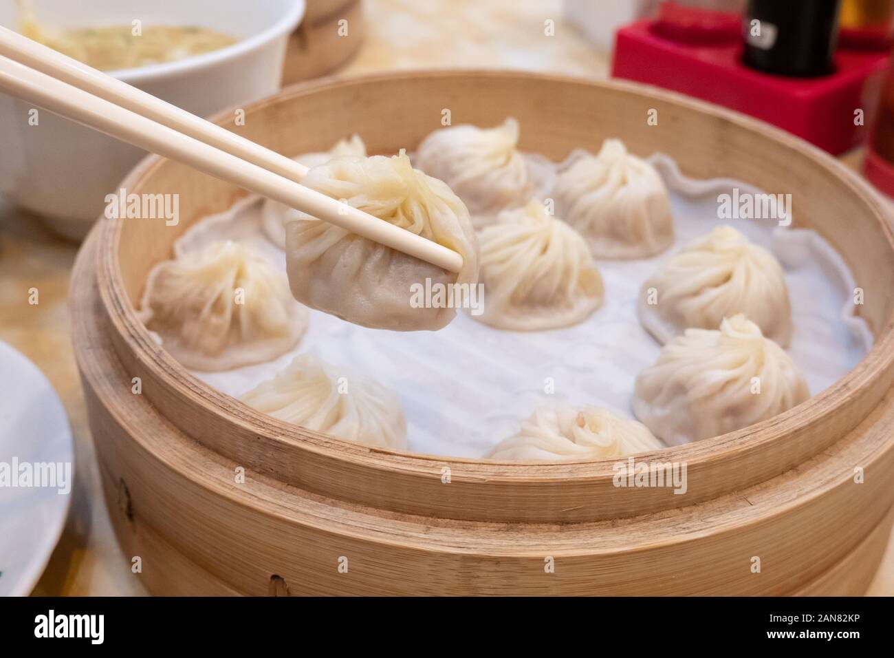 Xiao Long Bao Soup Dumpling Buns With Chopsticks In Restaurant ...