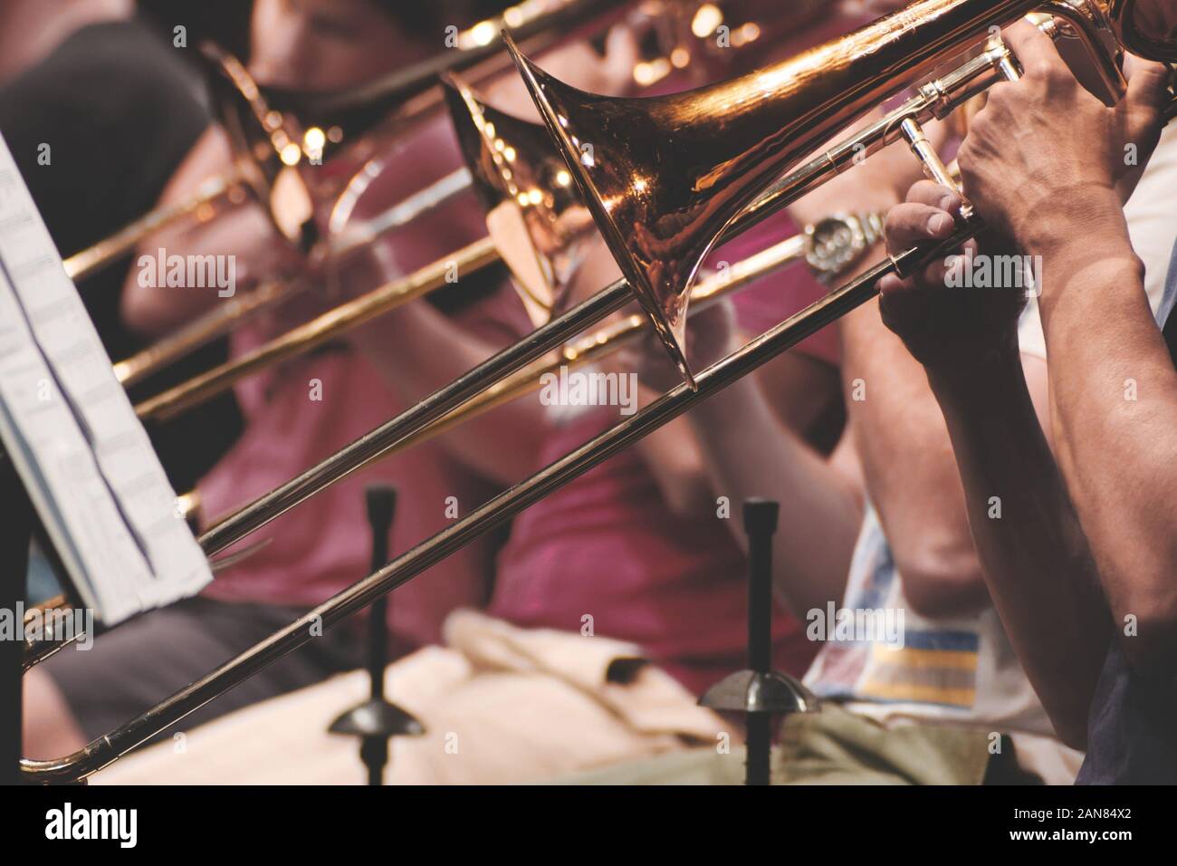 Musicians playing trombone in a brass band Stock Photo Alamy