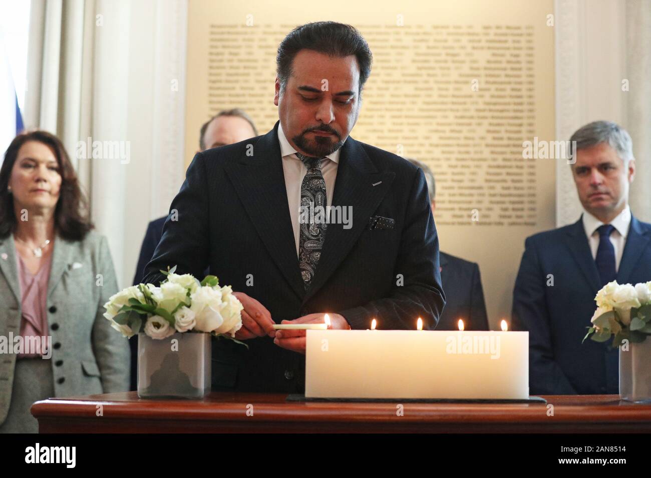Idrees Zaman, Acting Foreign Minister for Afghanistan, lights a candle at Canada House, central London for the passengers of the Ukrainian International Airlines flight that crashed just minutes after taking off from Imam Khomeini International Airport in Tehran, killing 176 people. Stock Photo