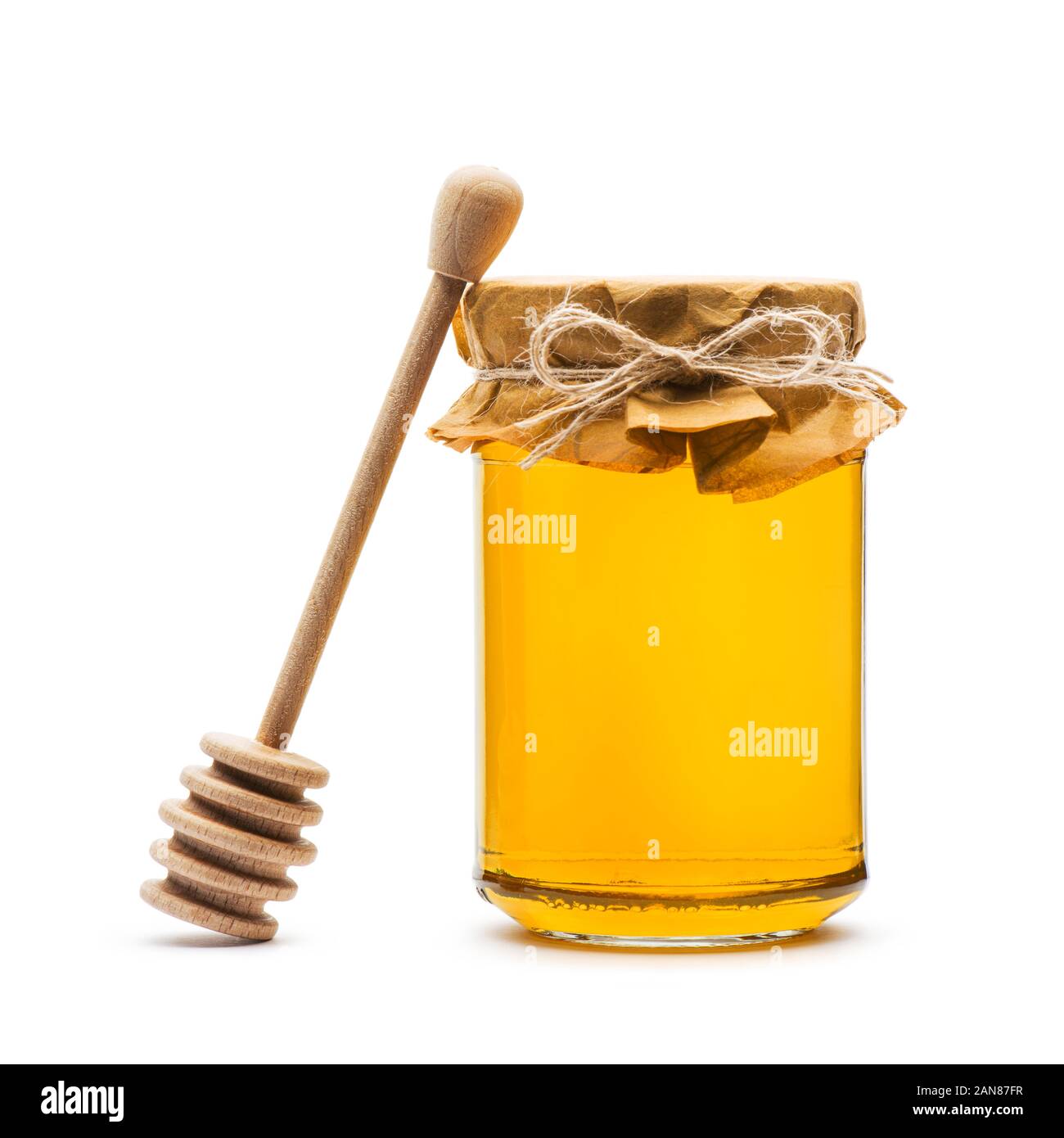 Honey jar with cap and wooden dripper, on white background Stock Photo