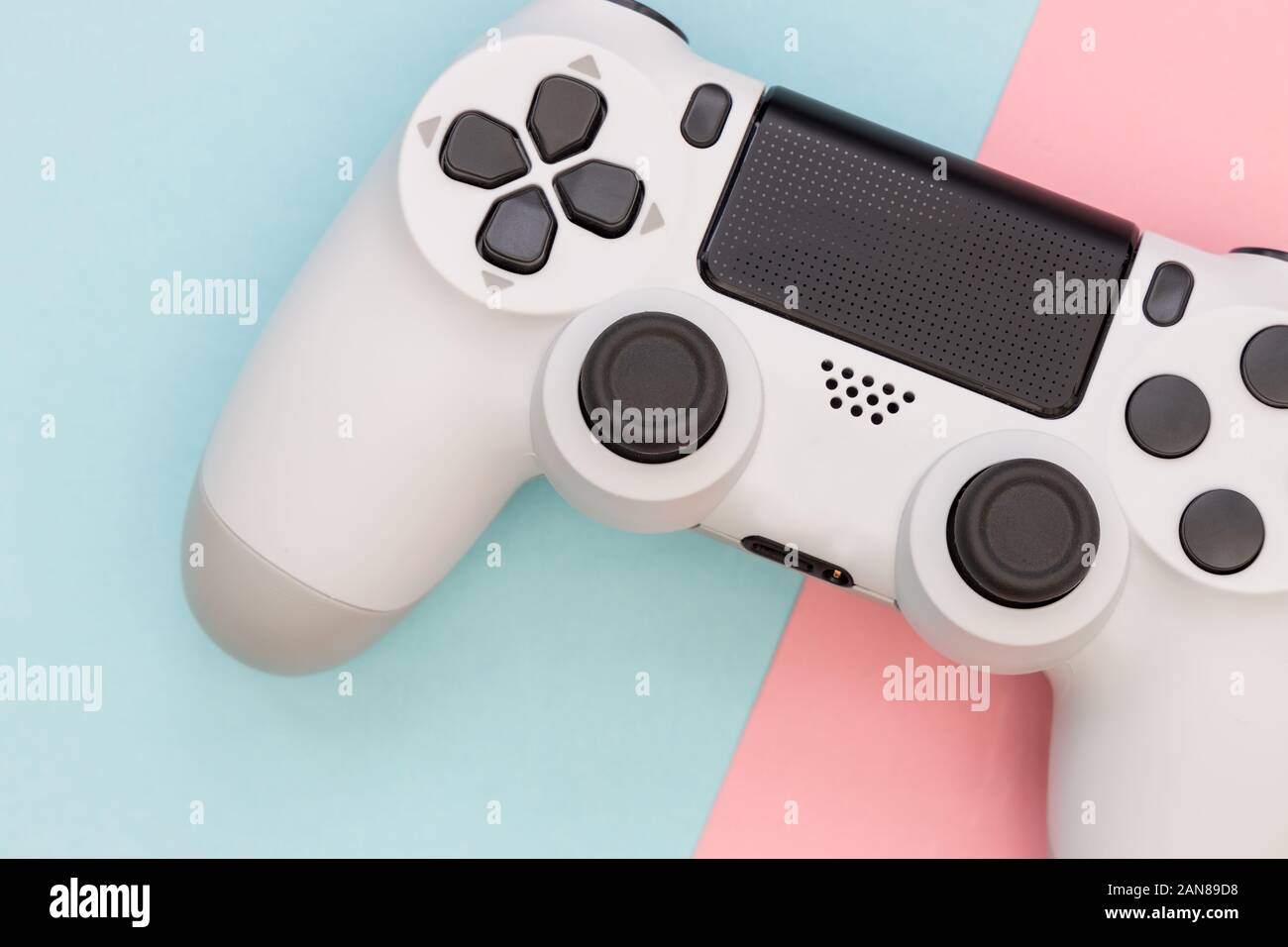 Video game gaming controller on pink color background top view Stock Photo