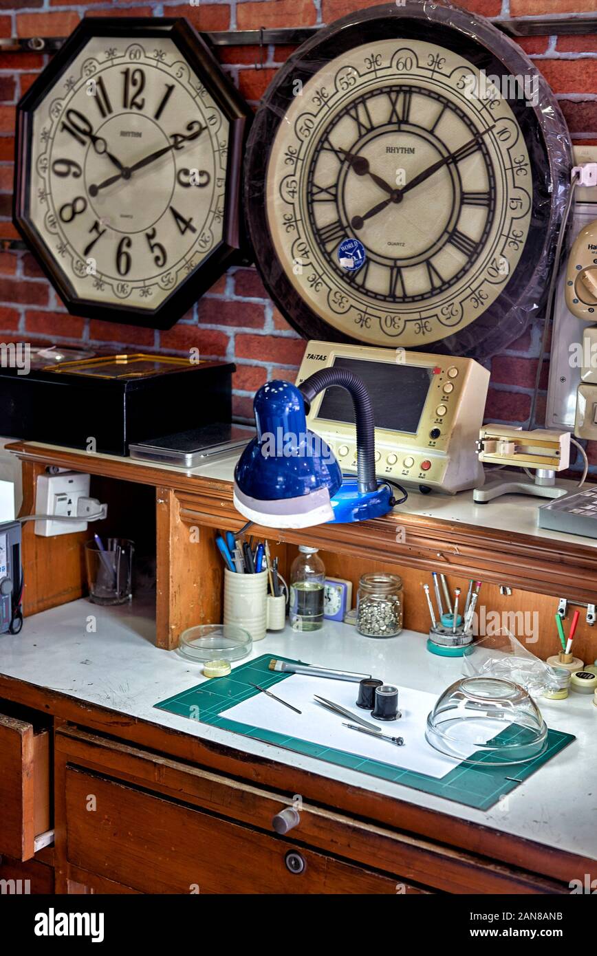Watch maker work top with craftsman's tools in a watch repair shop Horologist work tools and equipment Stock Photo