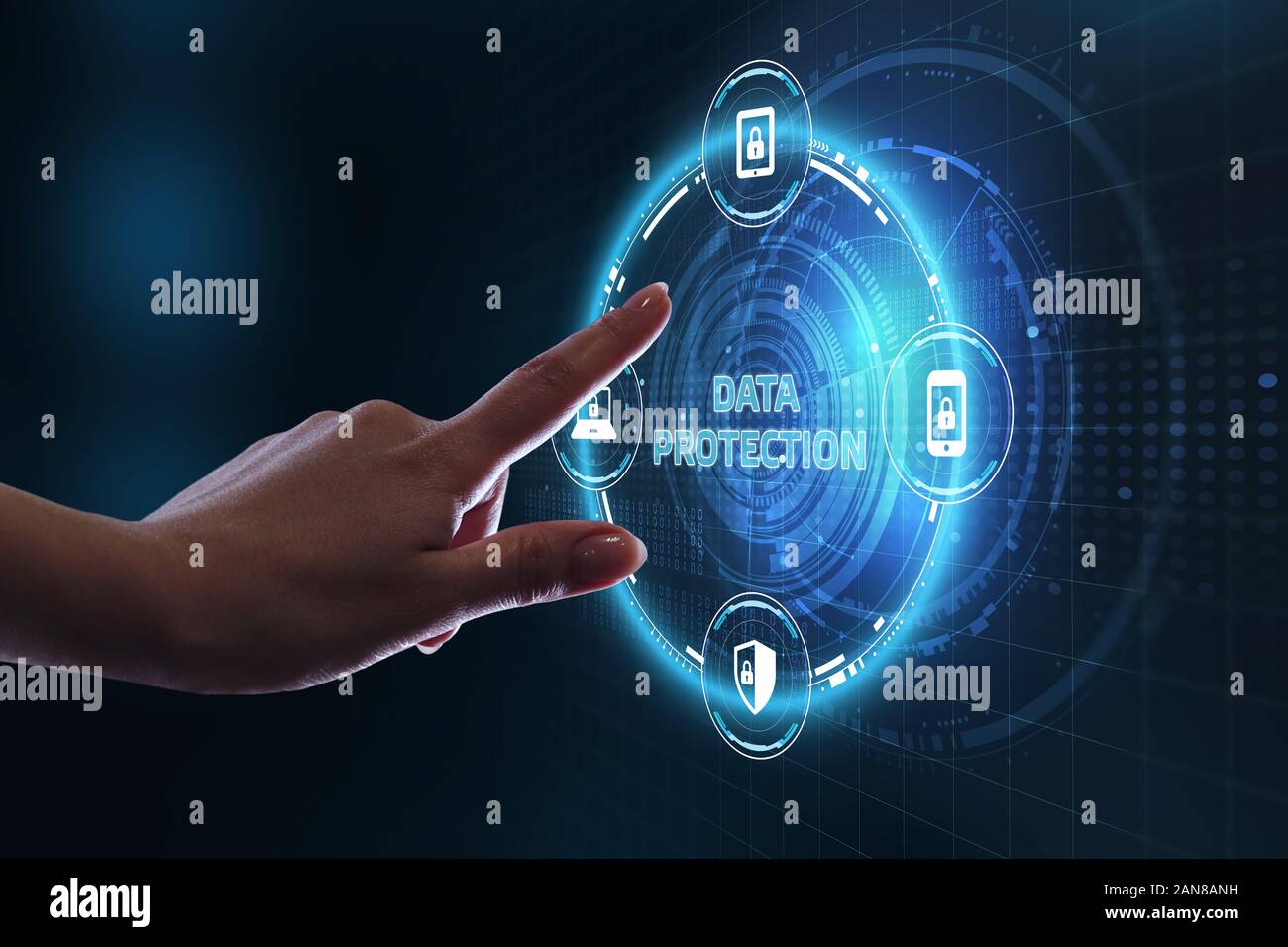 Business, technology, internet and networking concept. Young businessman select the icon Data protection  on the virtual display. Stock Photo