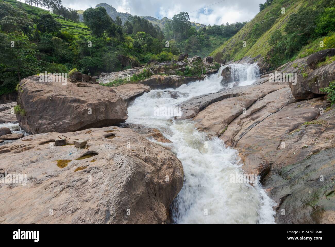 Atukkad Waterfalls near Munnar in Kerala, South India on cloudy day in rain season Stock Photo