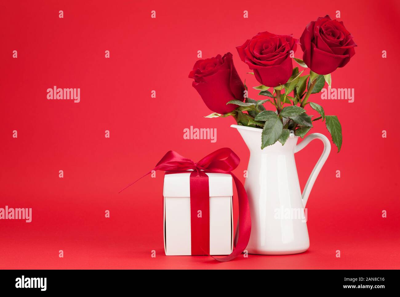 Valentines day greeting card with rose flower bouquet and gift box in ...