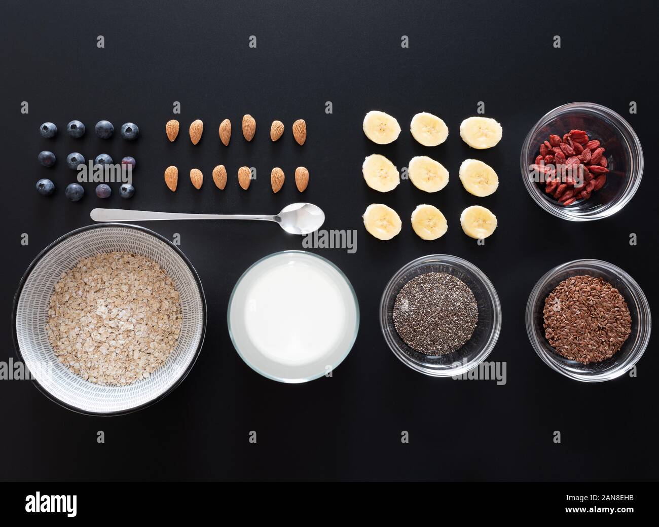 top view knolling shot of healthy breakfast with rolled oats, seeds, berries and fruits, healthy eating flat lay concept Stock Photo