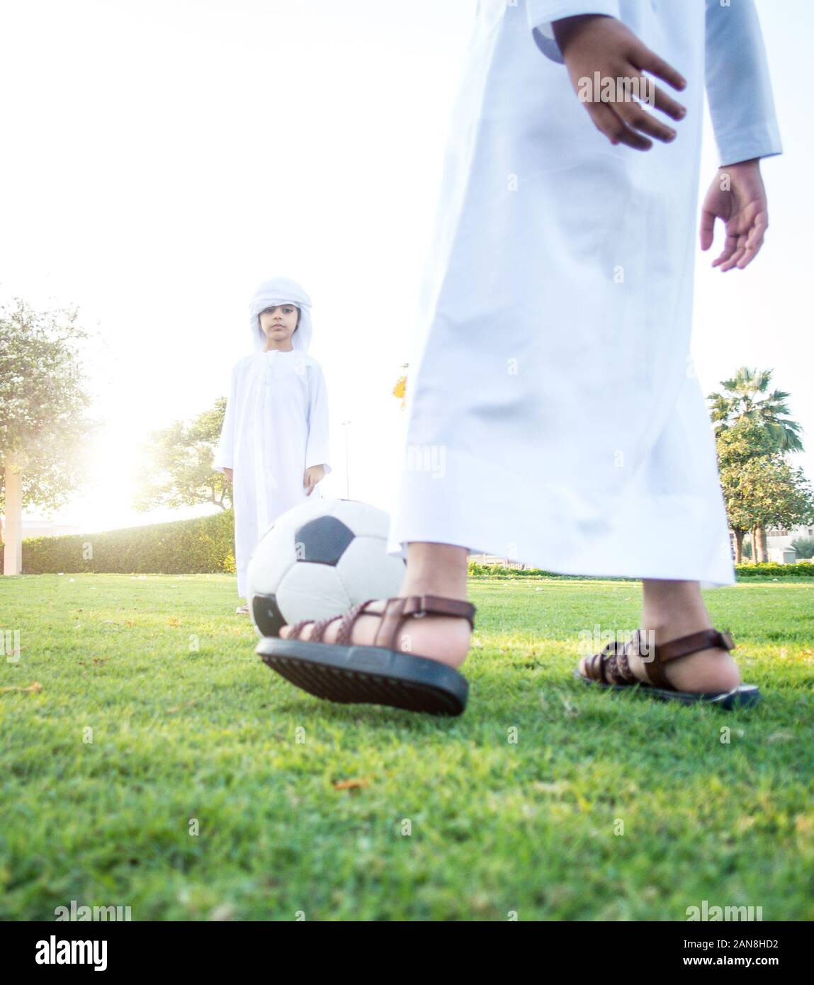 Children playing together in Dubai in the park. Group of kids wearing ...