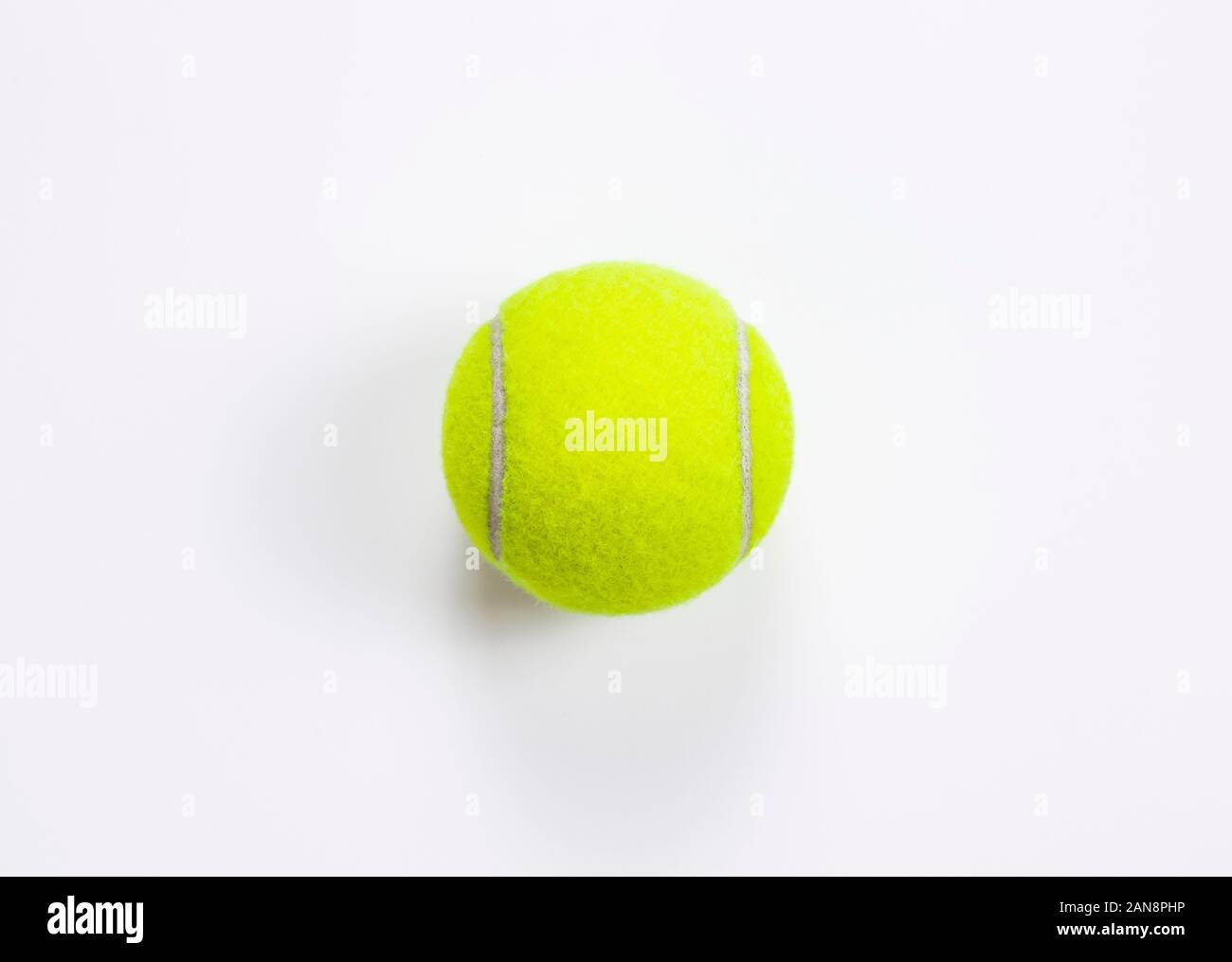 Single tennis ball isolated white background. Top view Stock Photo