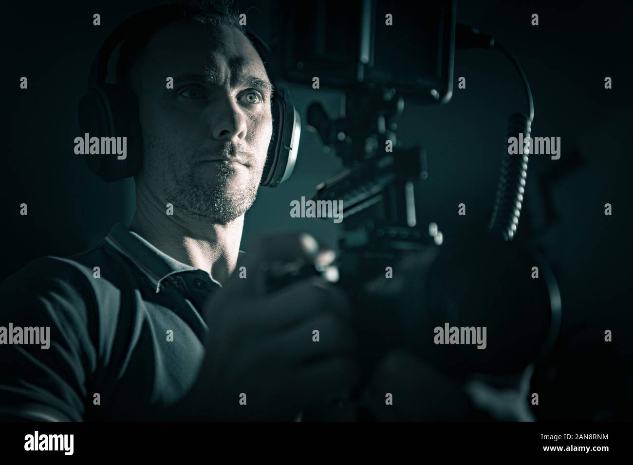 DSLR Rig Videography Film Camera Caucasian Operator with Headphones