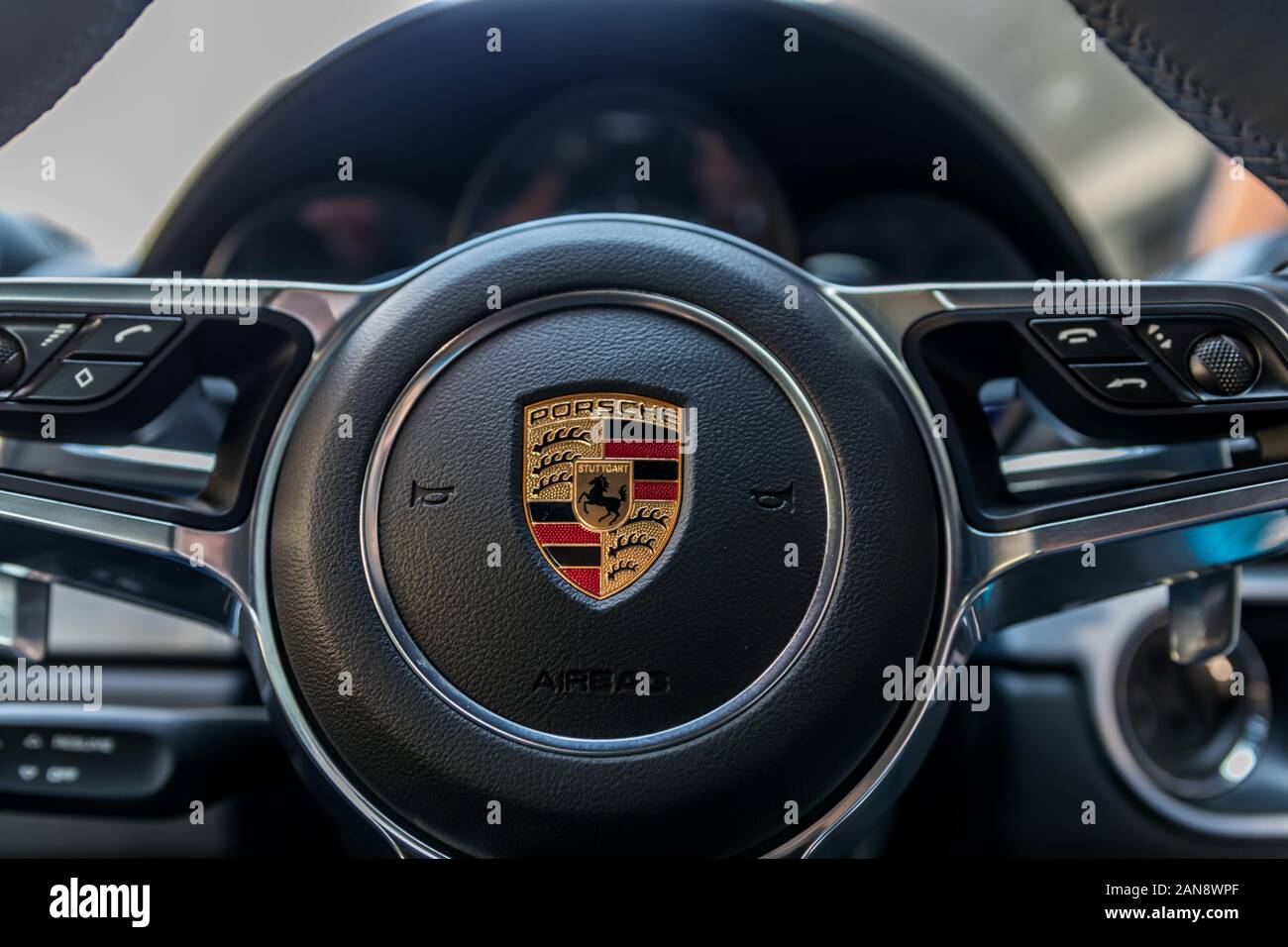 Closeup pf Porsche logo on steering wheel Stock Photo Alamy