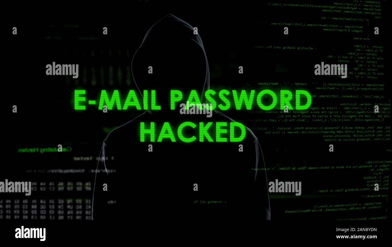 E-mail password hacked, criminal in black gets unauthorized access to data Stock Photo