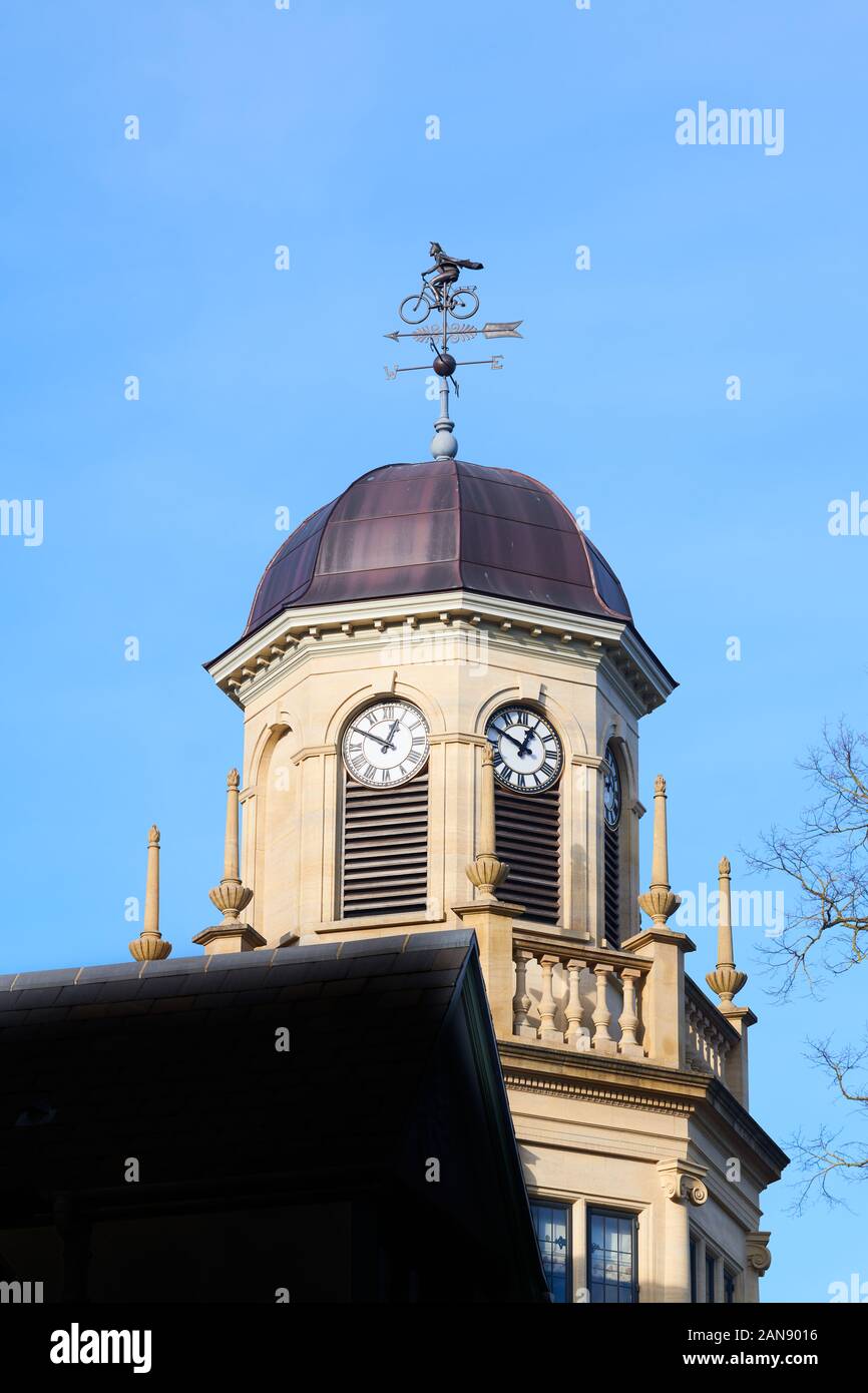 Weather vane topped by cycling academic on the cupola at the Harris Manchester college, university of Oxford, England. Stock Photo