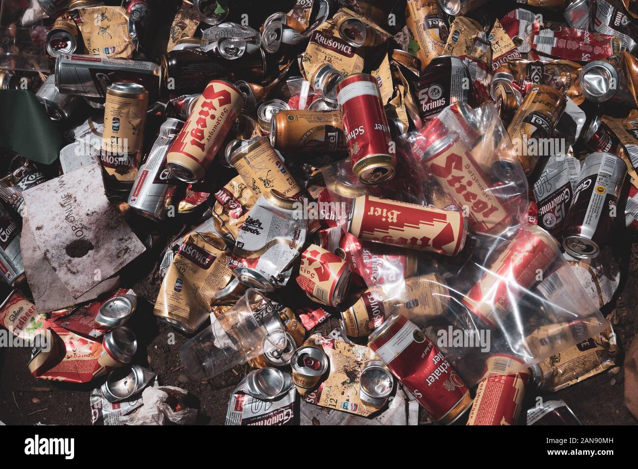 Smashed cans laying on the ground closeup angle view on a summer day ...