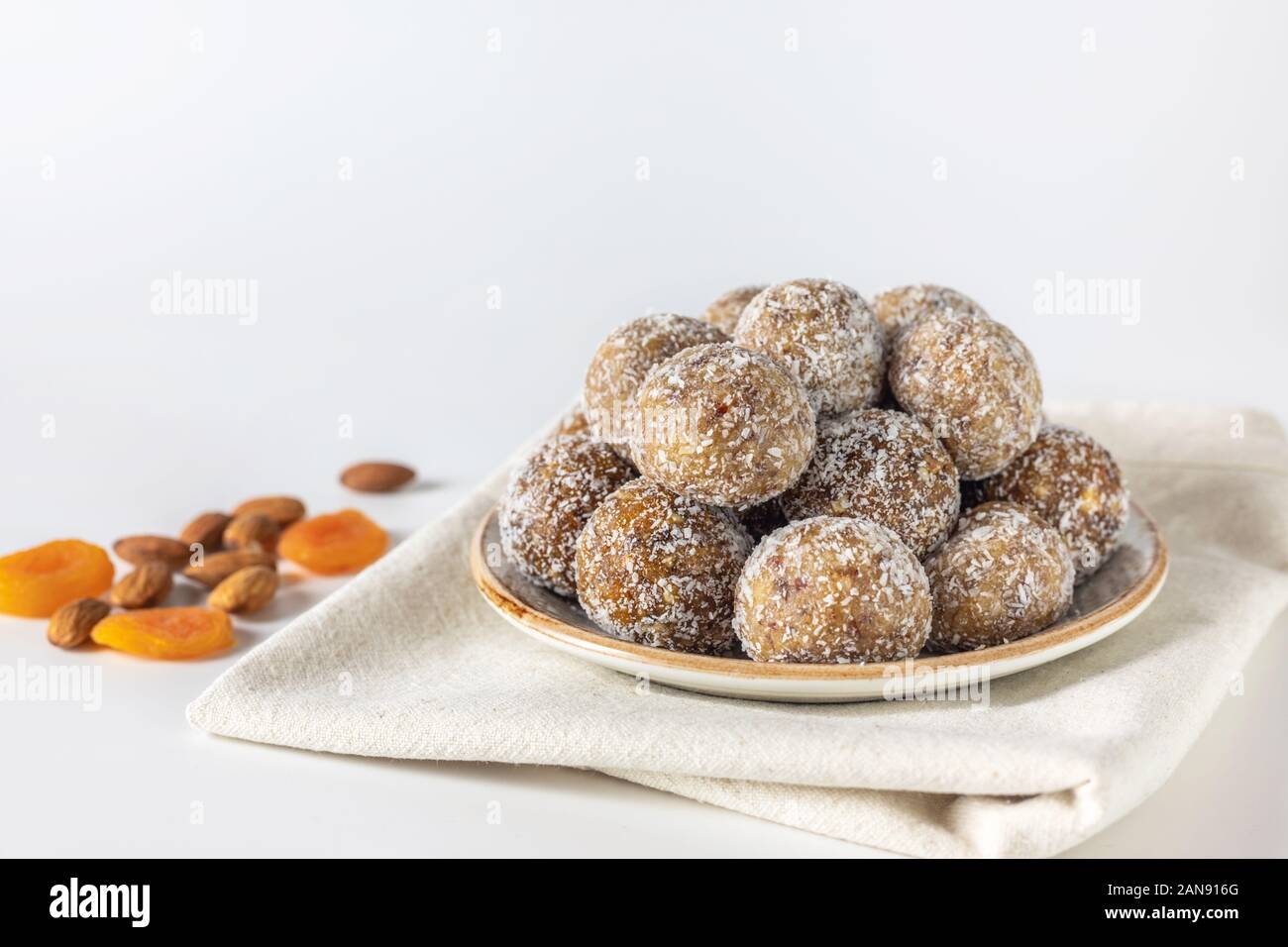 Homemade energy balls with dried apricots, raisins, dates, prunes ...