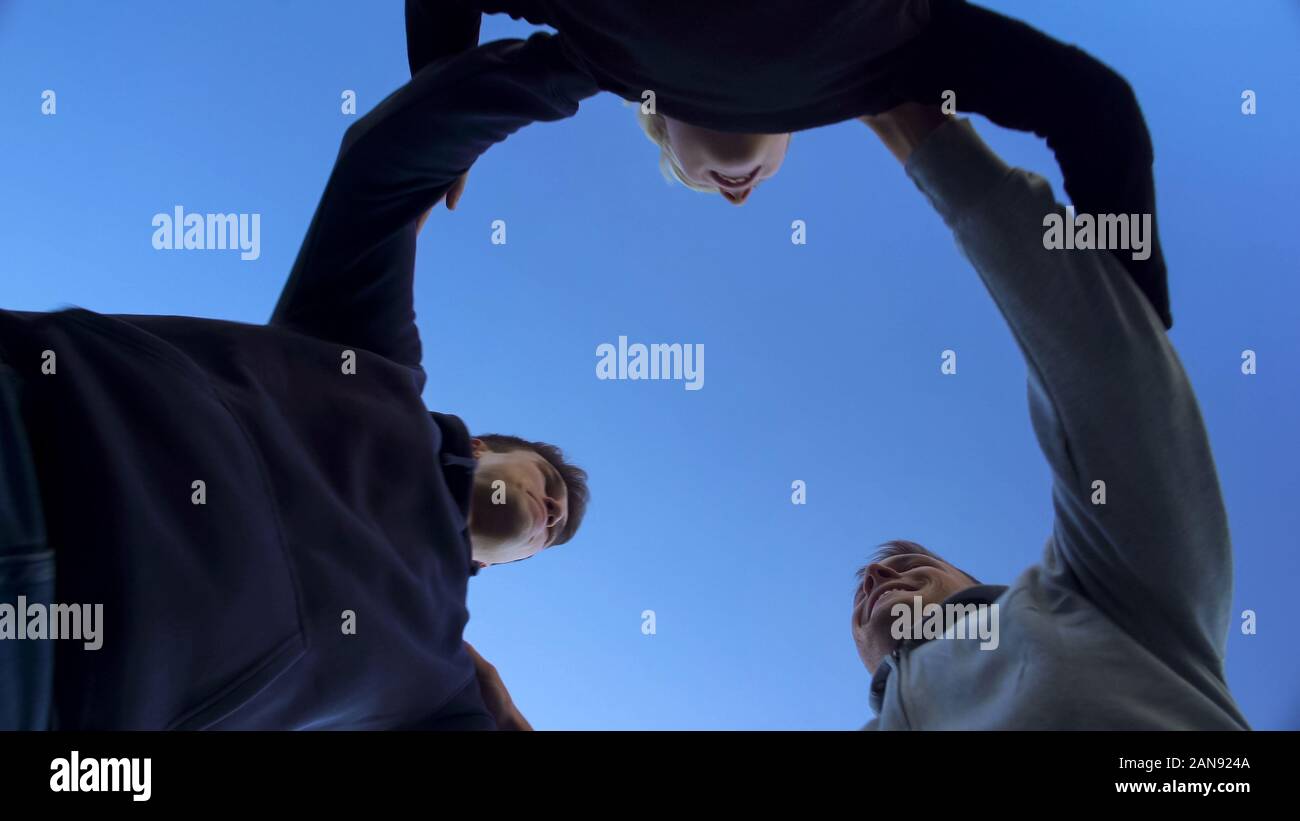 Group of friends hugging together, team work leads to victory, bottom ...