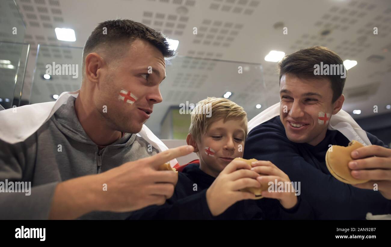 English football fans eating burgers after match, harmful effect of