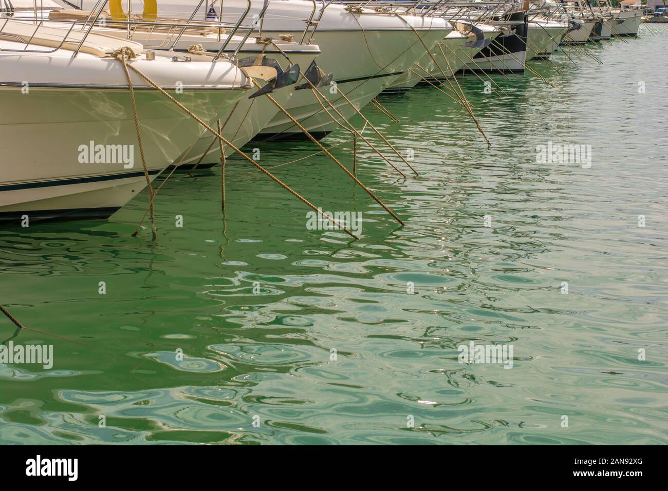 Boats moored in the harbor with copy space Stock Photo - Alamy