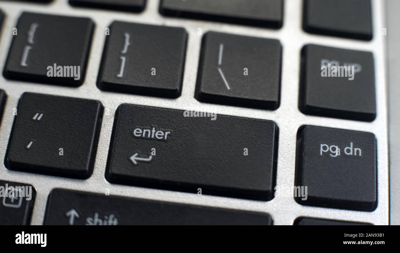 Enter button on laptop keyboard, programs easy access, data entry, return key Stock Photo