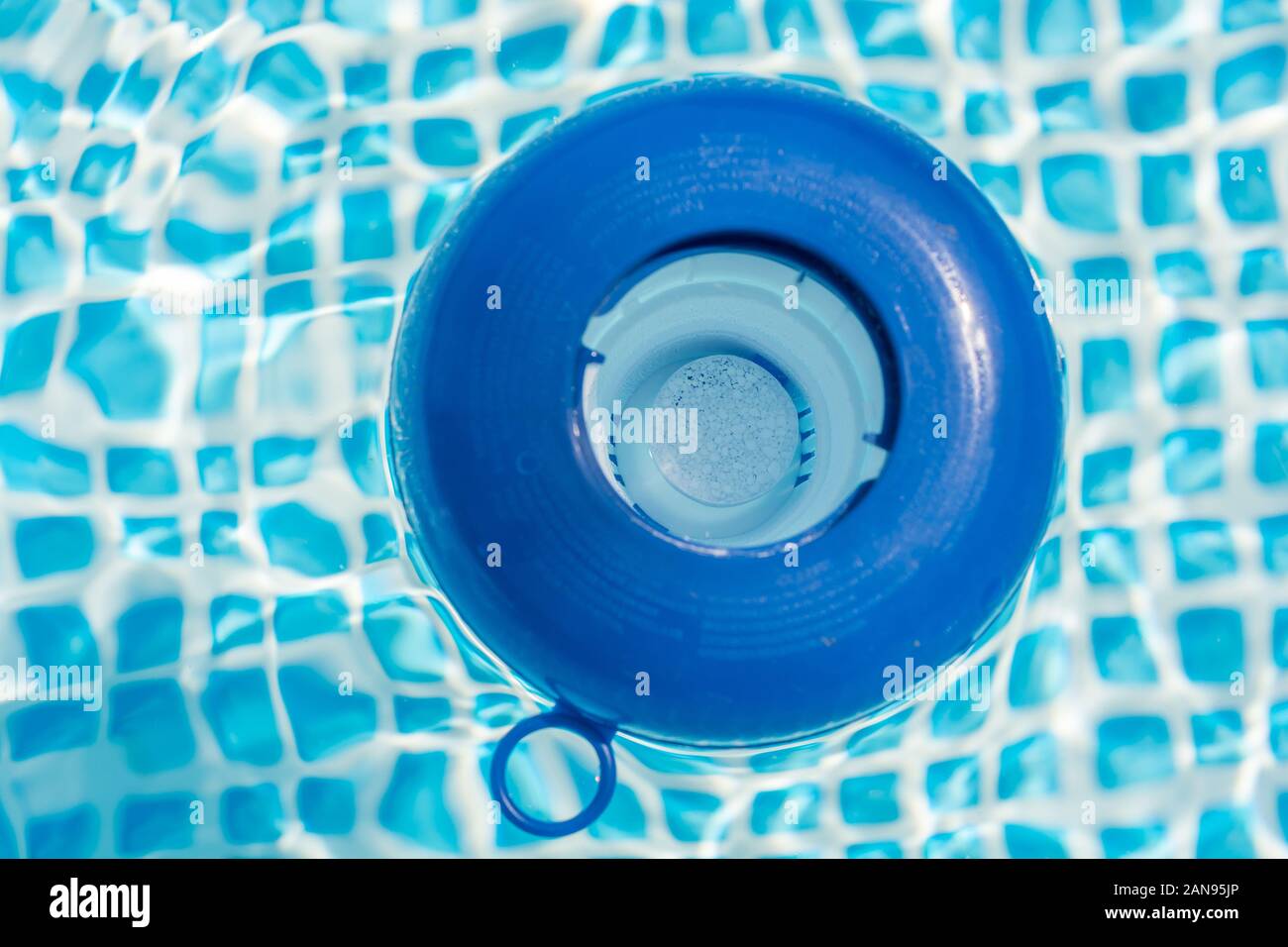 Chlorine tablet in a dosing float in a pool Stock Photo Alamy