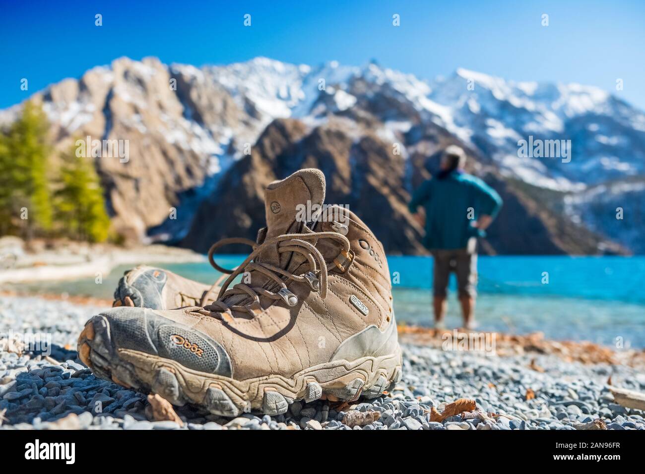 Pair of walking / hiking boots on the shore of Phoksundo Lake, Dolpo