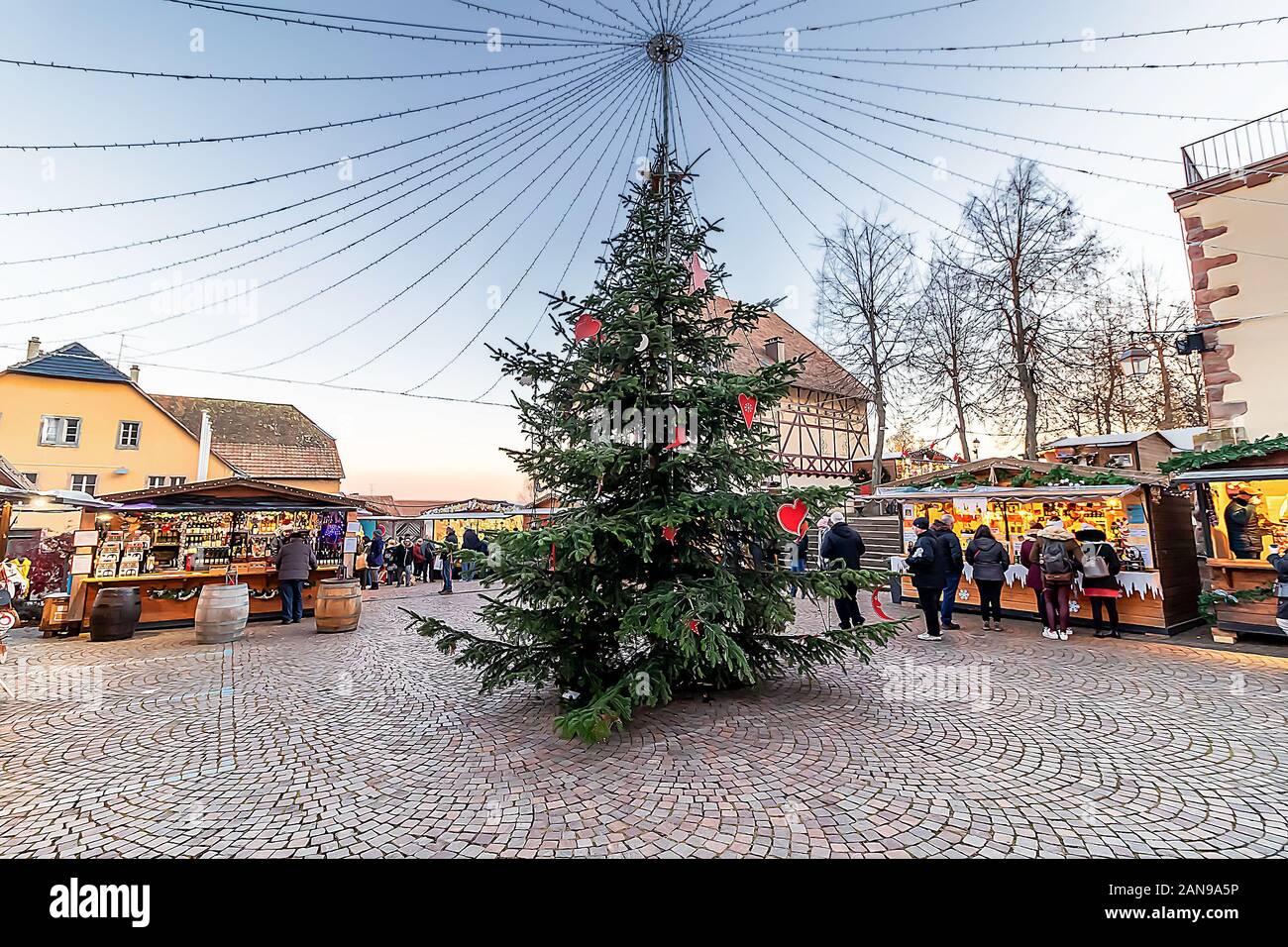 Basel, Switzerland - December 6,2019: Christmas tree in Riquewihr town at evening, in Alsace wine region, France Stock Photo