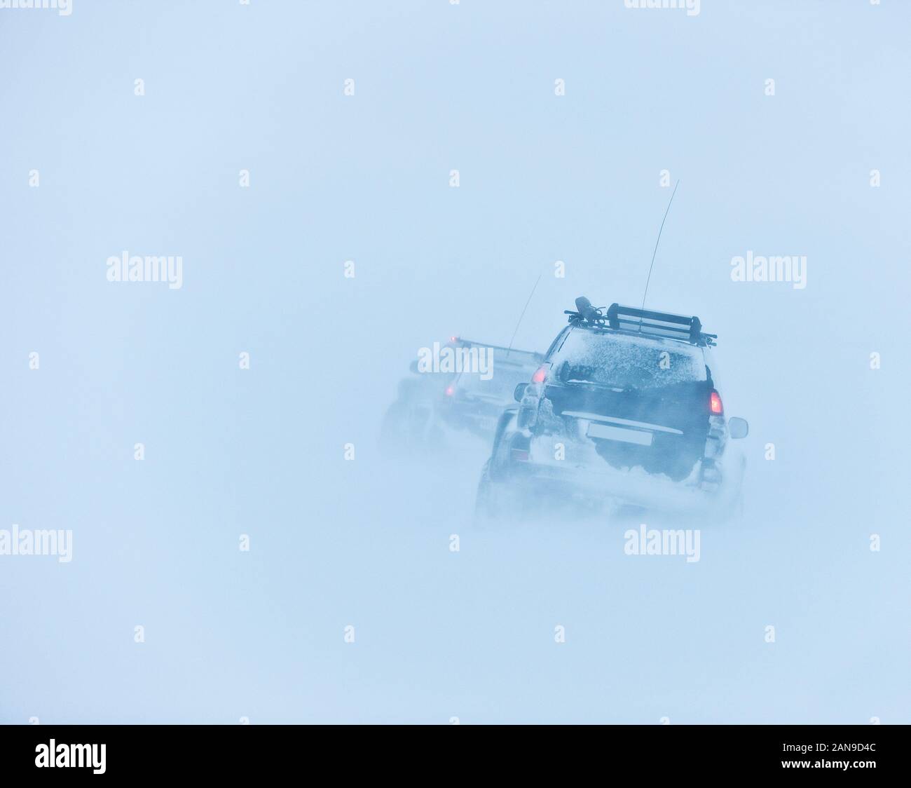 Jeeps traveling in a blizzard, Iceland Stock Photo