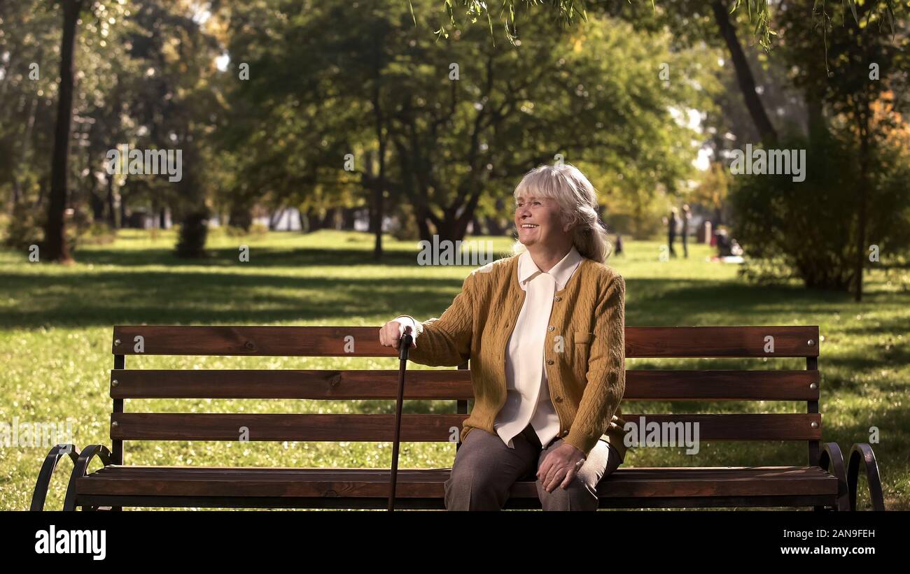 Old woman walking stick hi-res stock photography and images - Alamy