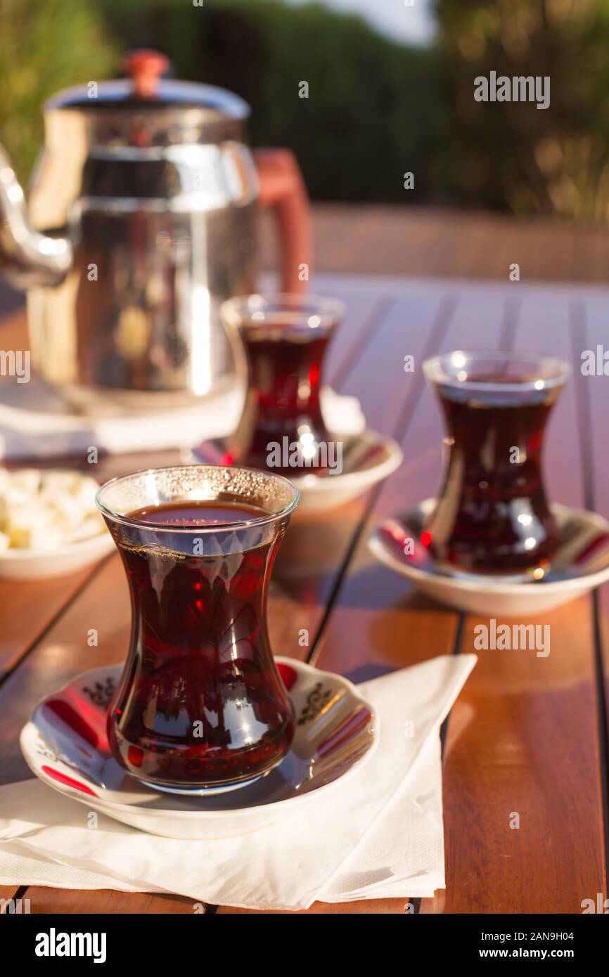 https://c8.alamy.com/comp/2AN9H04/turkish-tea-with-teapot-and-locum-in-outdoor-cafe-direct-sunset-light-shallow-dof-and-lightly-toned-2AN9H04.jpg