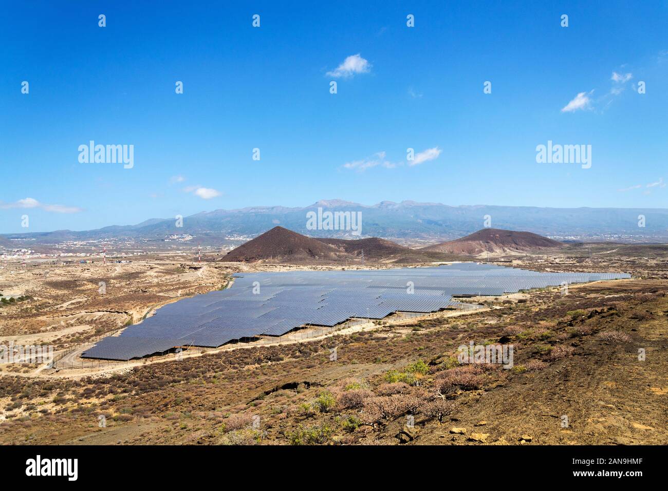 Solar panels at photovoltaics power station farm, future innovation energy concept, blue sky with Mount Teide in background, Tenerife, Canary Island, Stock Photo