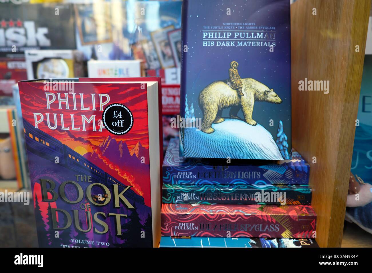 Philip Pullman The Book of Dust book front cover & His Dark Materials in Waterstones bookstore window display in 2019 London England UK  KATHY DEWITT Stock Photo