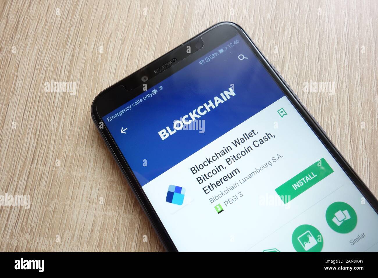 Blockchain Wallet app on Google Play Store website displayed on Huawei Y6 2018 smartphone Stock Photo