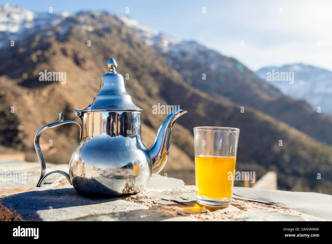 Moroccan mint tea and kettle in high atlas mountains hi-res stock