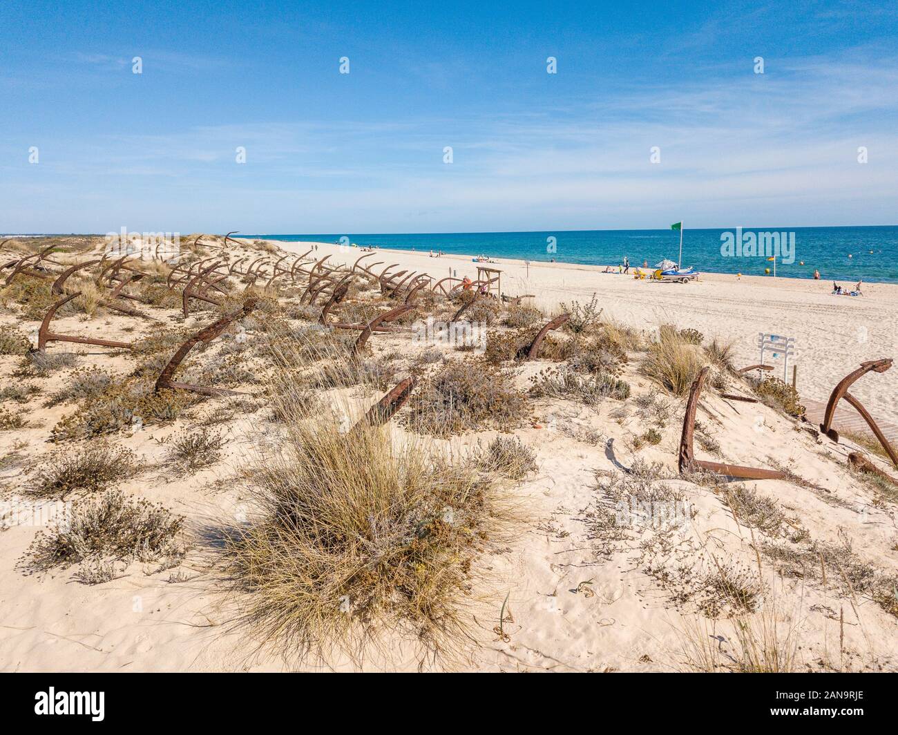 Anchor graveyard on snady dunes of Barril beach, Algarve, Portugal Stock Photo