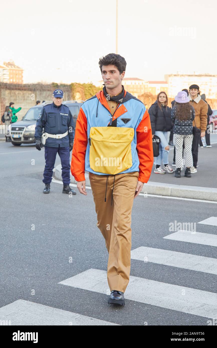 MILAN, ITALY - JANUARY 12, 2019: Man with Prada jacket in yellow, blue and  orange colors before Prada fashion show, Milan Fashion Week street style  Stock Photo - Alamy
