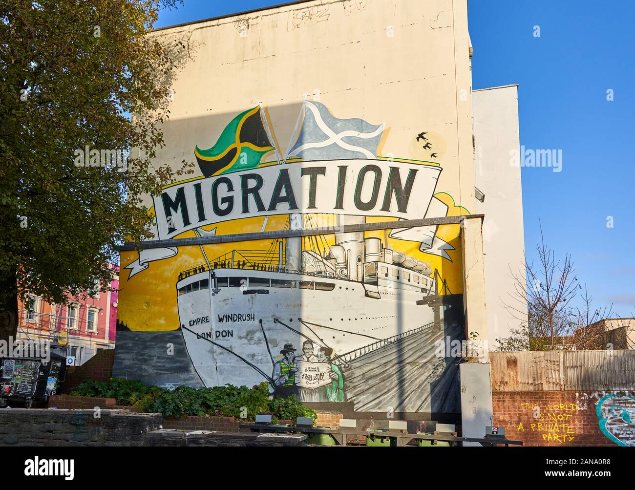 Giant mural on a St Paul's terrace-end in Bristol commemorating the Windrush generation's arrival in the UK Stock Photo