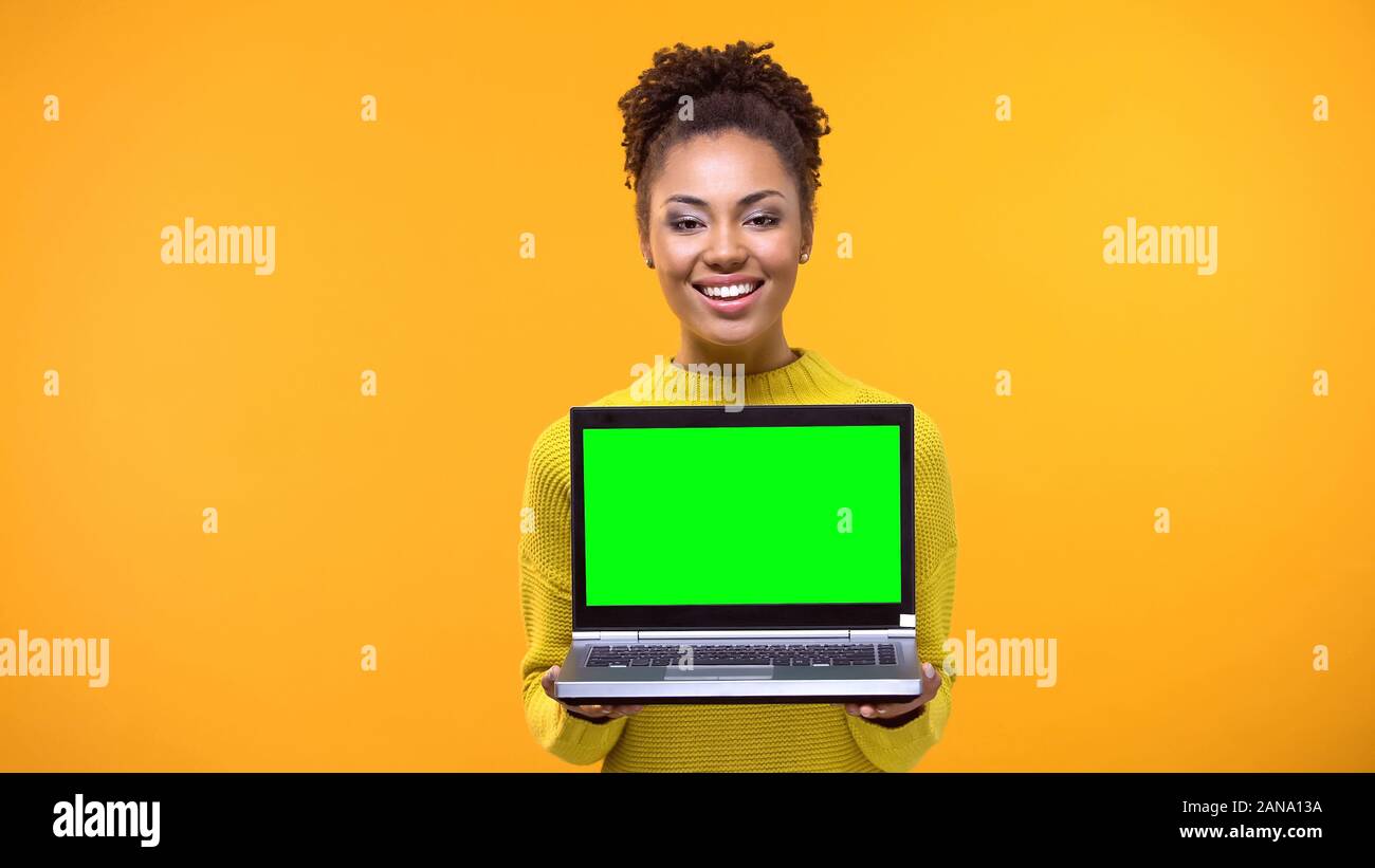 Bookmakers Computer Screen Beautiful woman holding green screen laptop, shopping online ...