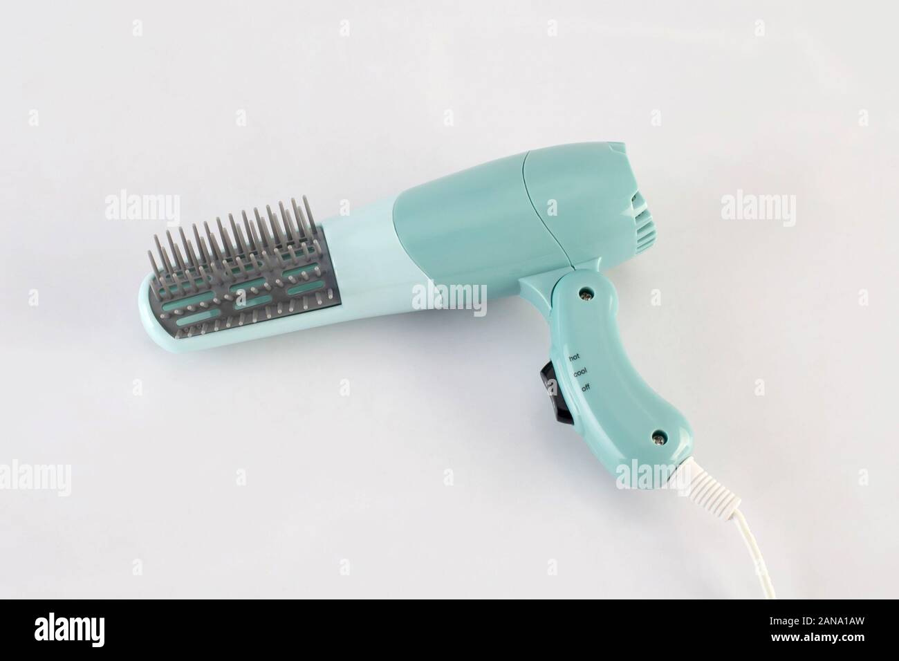 green hair dryer with comb isolated on white background Stock Photo