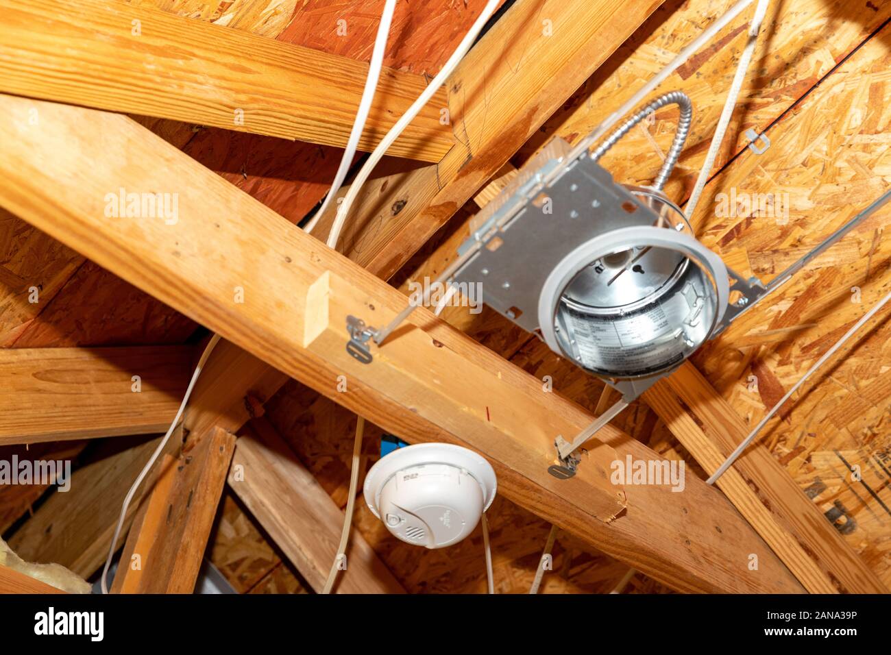 Electrical recessed can lights and vents during new construction Stock Photo
