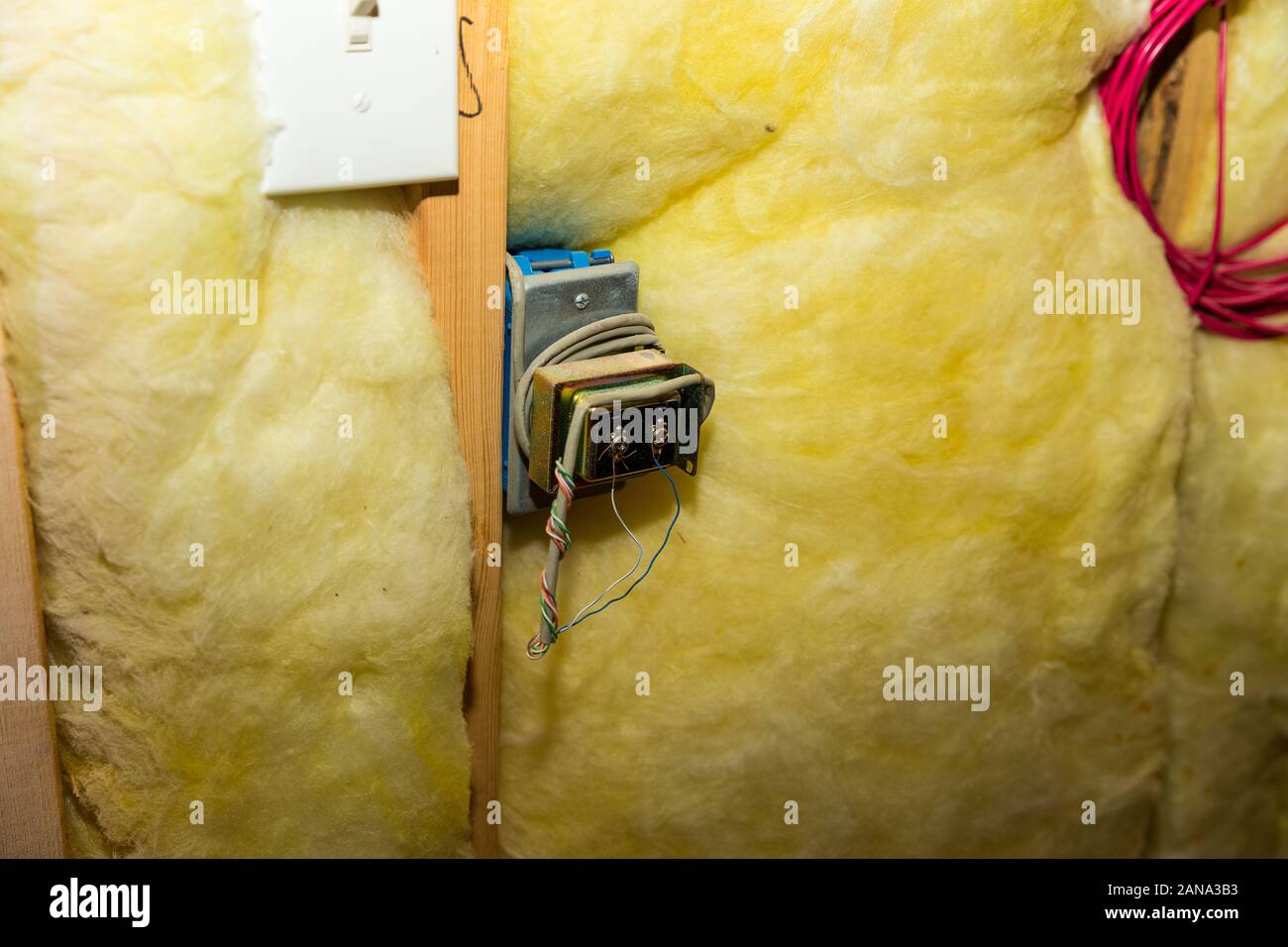 Doorbell transformer and wiring in a home attic. Stock Photo