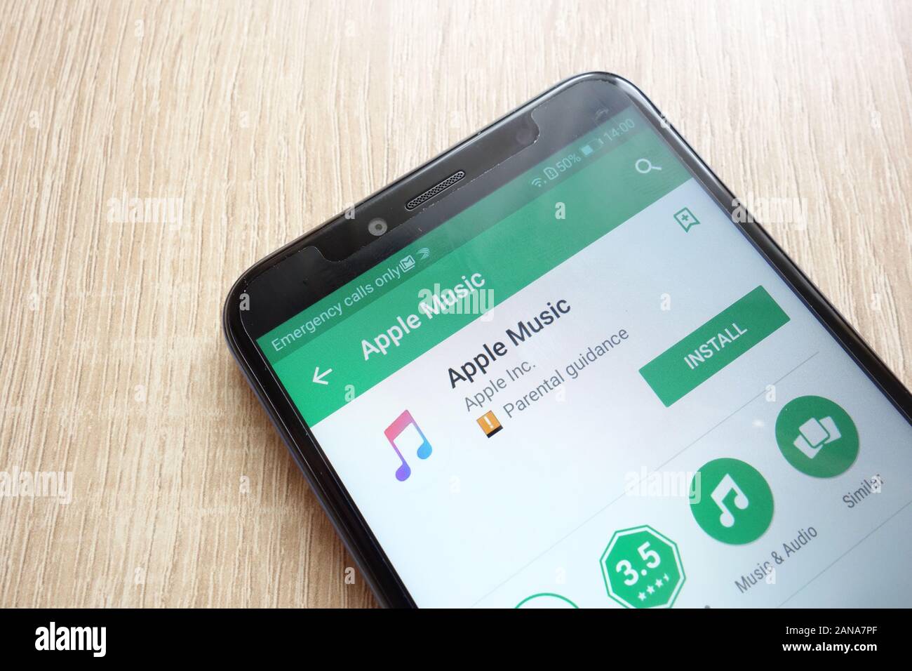 Apple Music app on Google Play Store website displayed on Huawei Y6 2018 smartphone Stock Photo