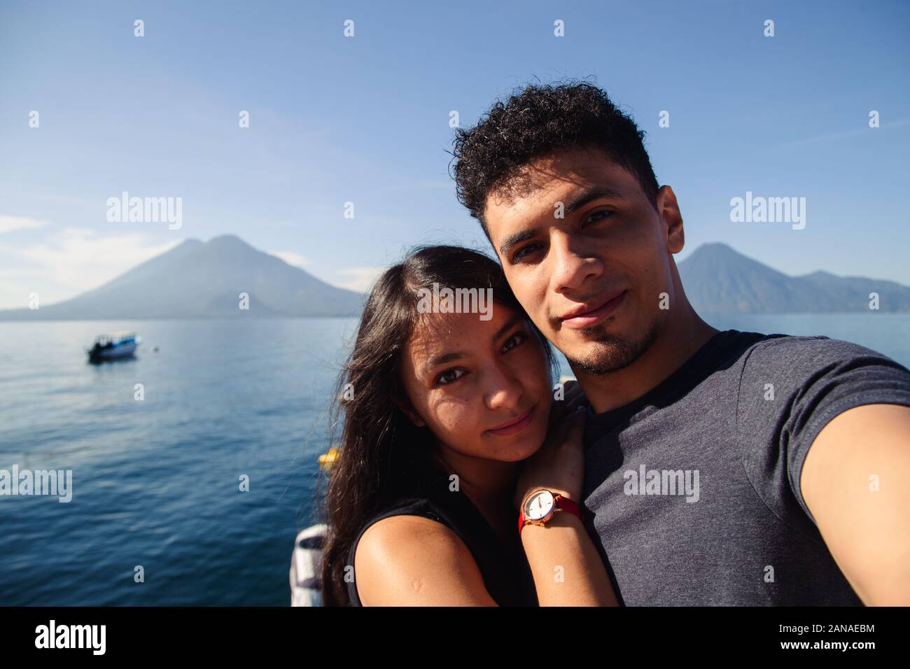Traveling couple taking a selfie at Lake Atitlan in Guatemala Stock Photo
