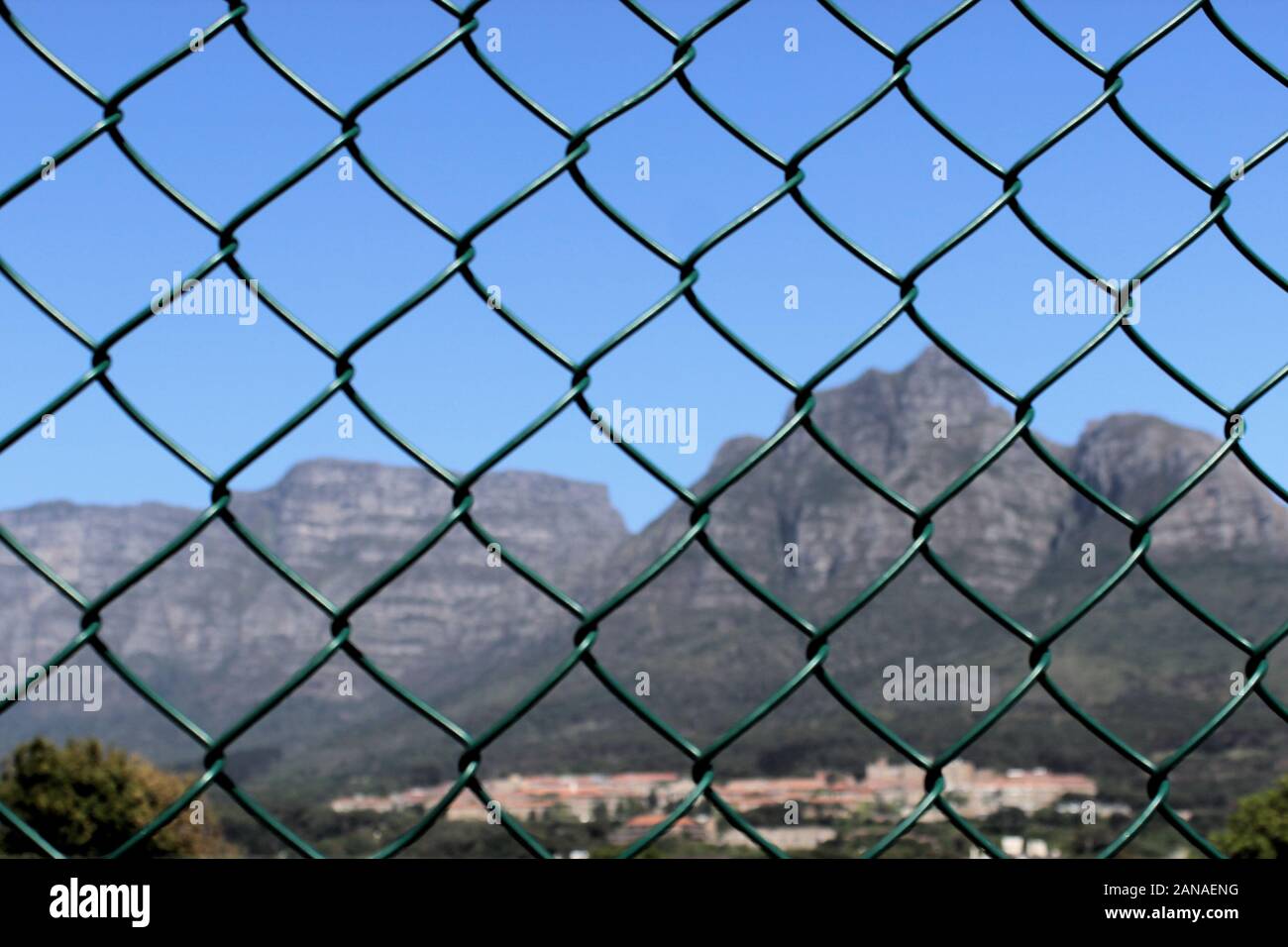 Table mountain view through tennis court netting Stock Photo Alamy