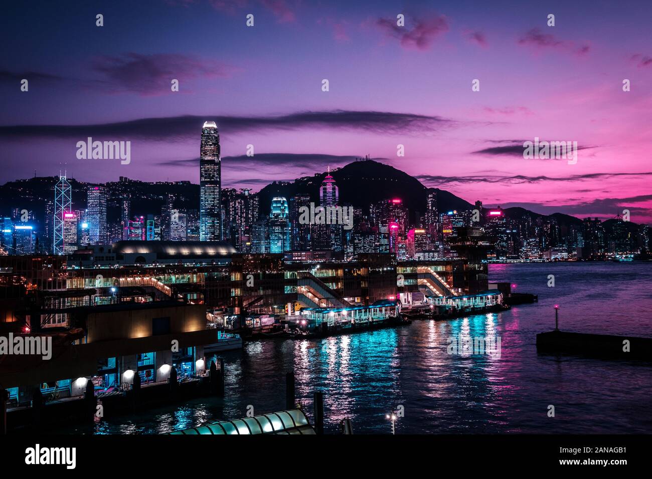 HongKong Island skyline and Victoria Harbour at night  - Stock Photo