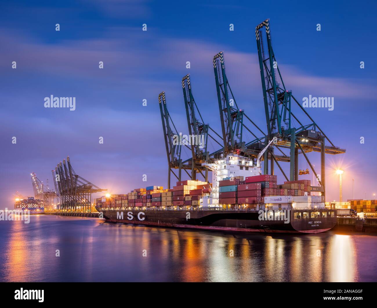ANTWERP-DEC. 24, 2019. Moored containership at twilight in Port of Antwerp. Antwerp is one of the fastest growing European container Ports. Stock Photo