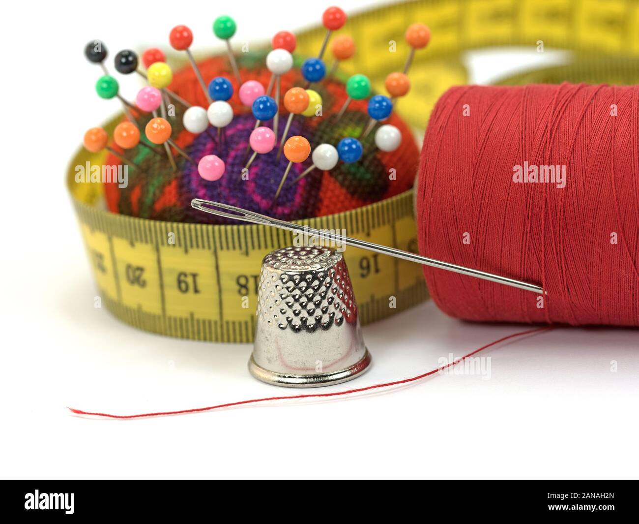 Heap of multi-coloured sewing pins on a white background, Stock image