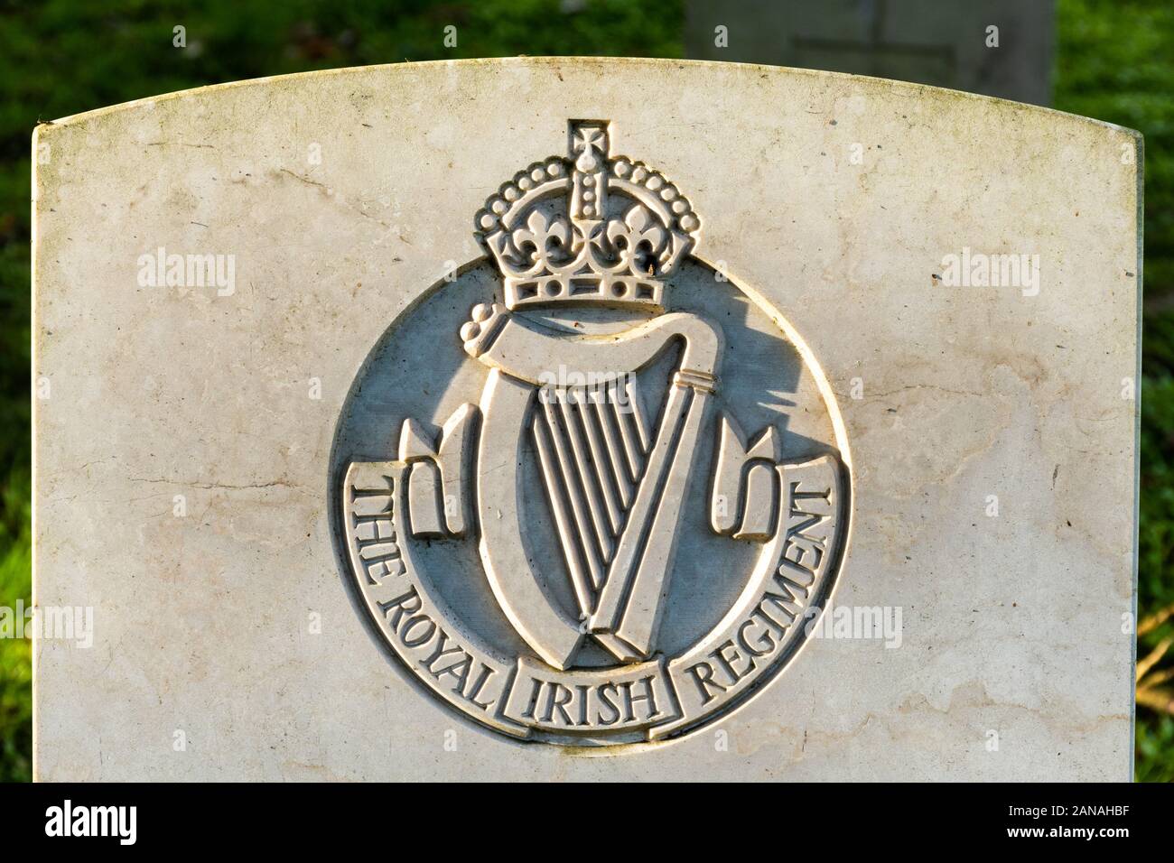 The Royal Irish Regiment regimental badge emblem crest on a world war one gravestone or headstone, UK Stock Photo