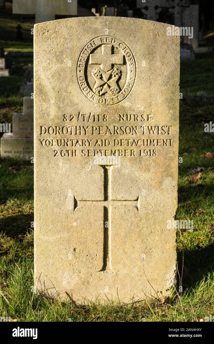 Grave of a nurse from the Voluntary Aid Detachment killed during world war one, UK, with emblem of the Order of St John and British Red Cross. Stock Photo